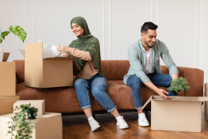 Couple unpacking their boxes in new home